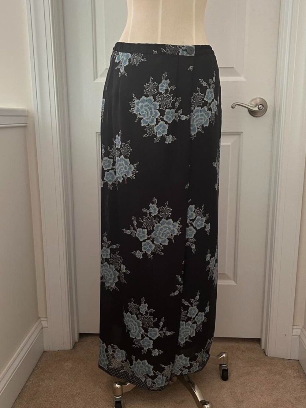 Black maxi skirt with blue floral embroidery. unknown brand Size: M